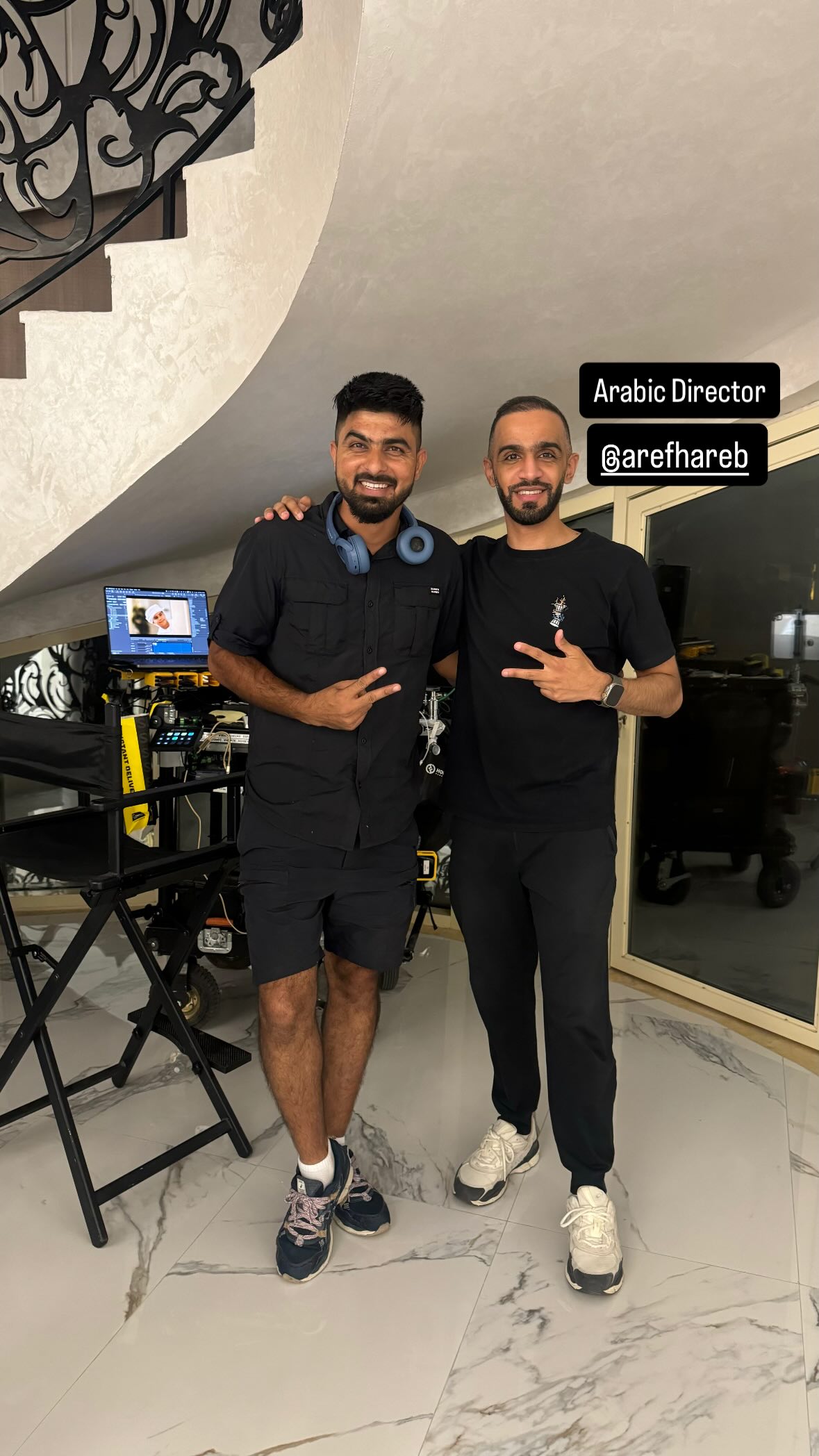 Umair Alam with director Aref Hareb on set